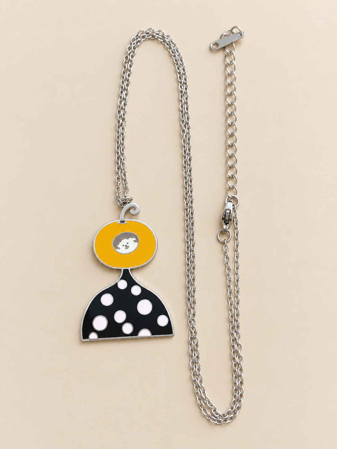 Doobee Custom Drawing Necklace with a colourful enamel pendant shaped like a pumpkin-headed character